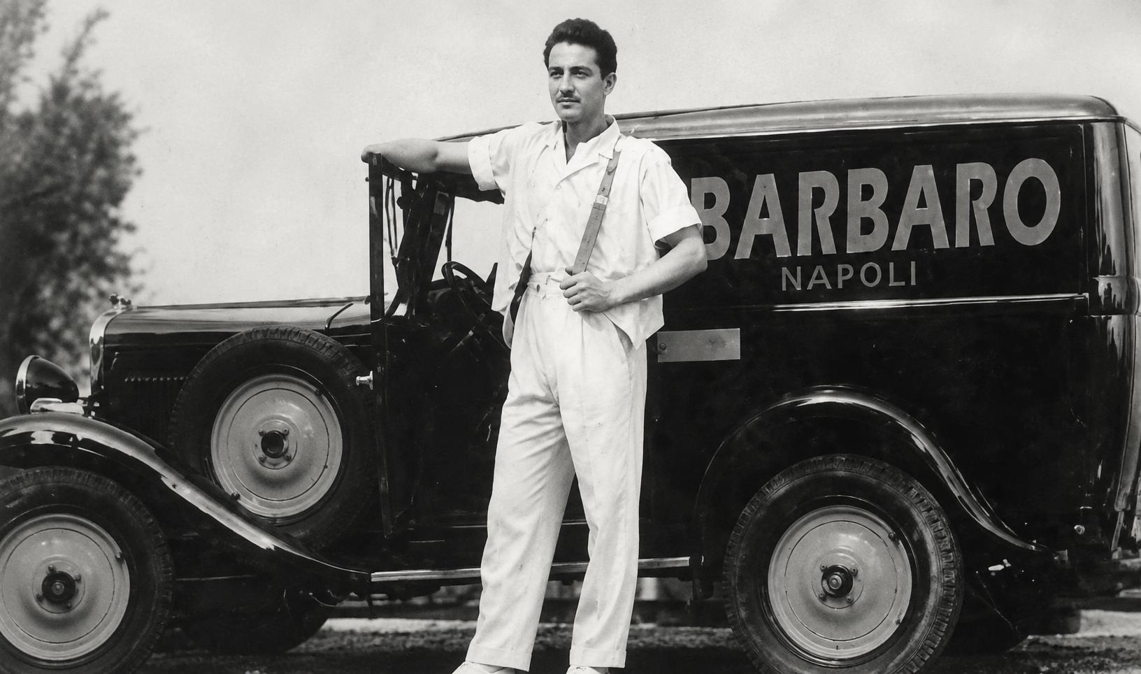 Don Giovanni Iovine beside a Caffè Barbaro delivery van